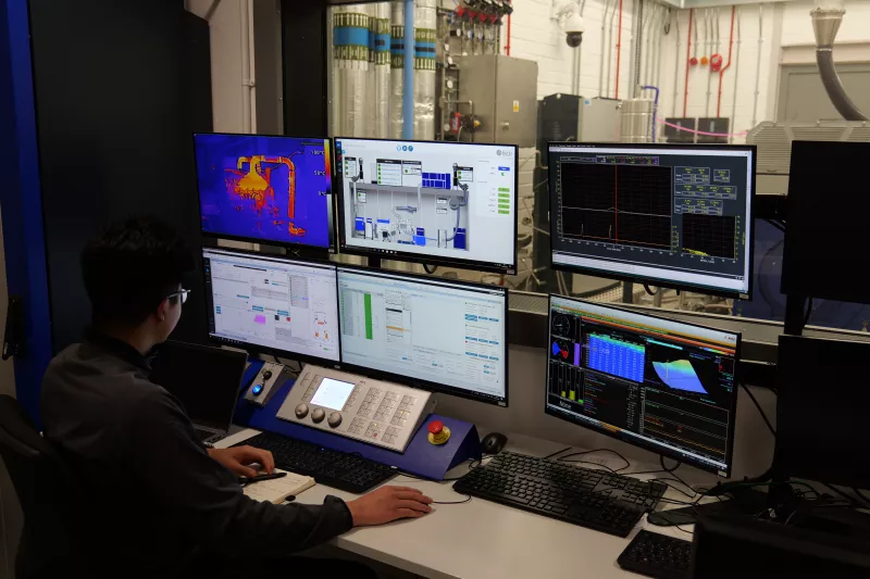 Man operating safety systems on computer