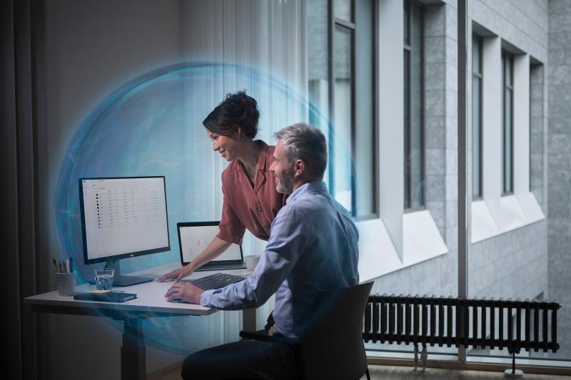 man and woman working with computer