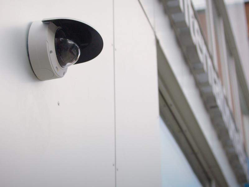 Axis IP camera mounted on a wall faced outwards