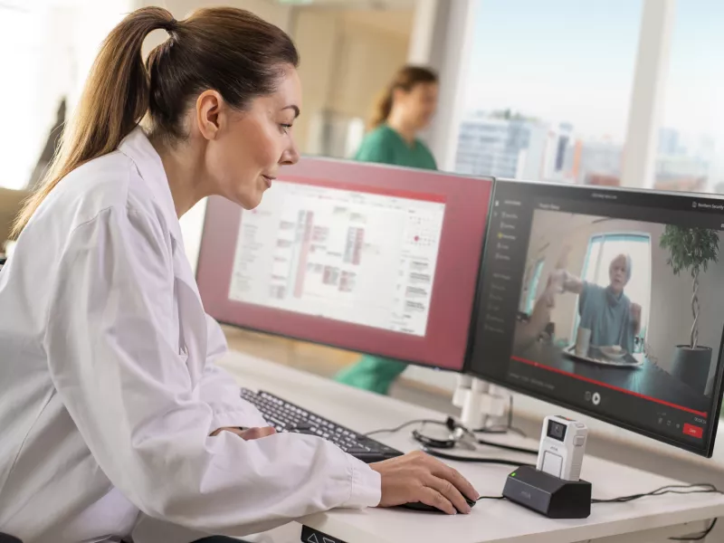 doctor monitoring live streaming from body worn camera