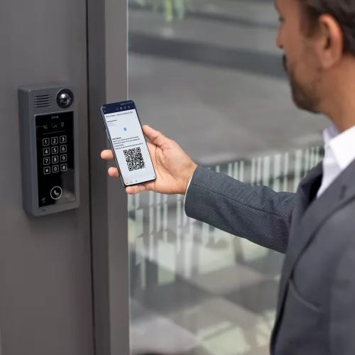 Man using mobile with QR code through A8207-VE to access door