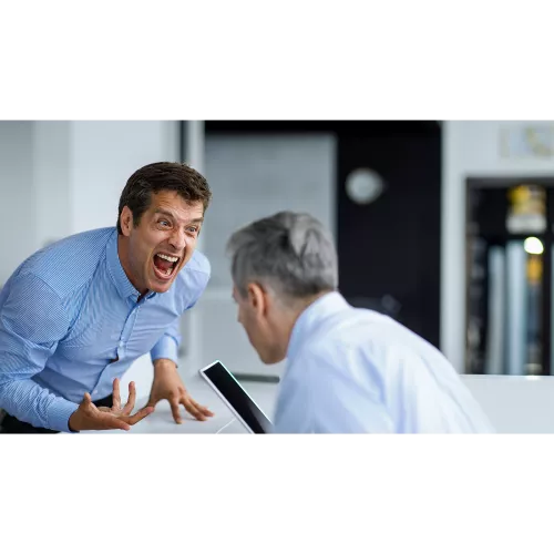 businessman screaming agressive in office environment